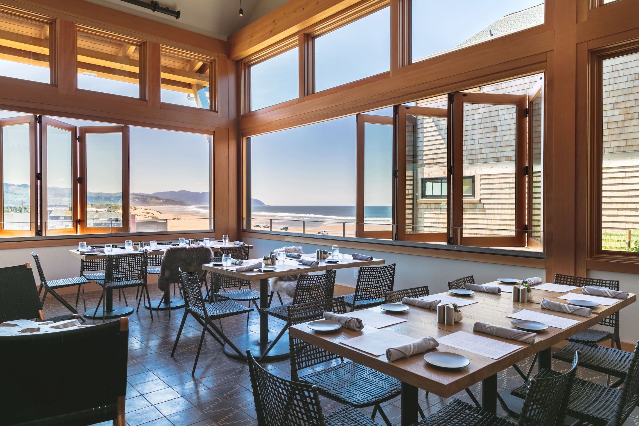 Inside a restaurant at Inn at Cape Kiwanda with a beautiful view of the beach and ocean