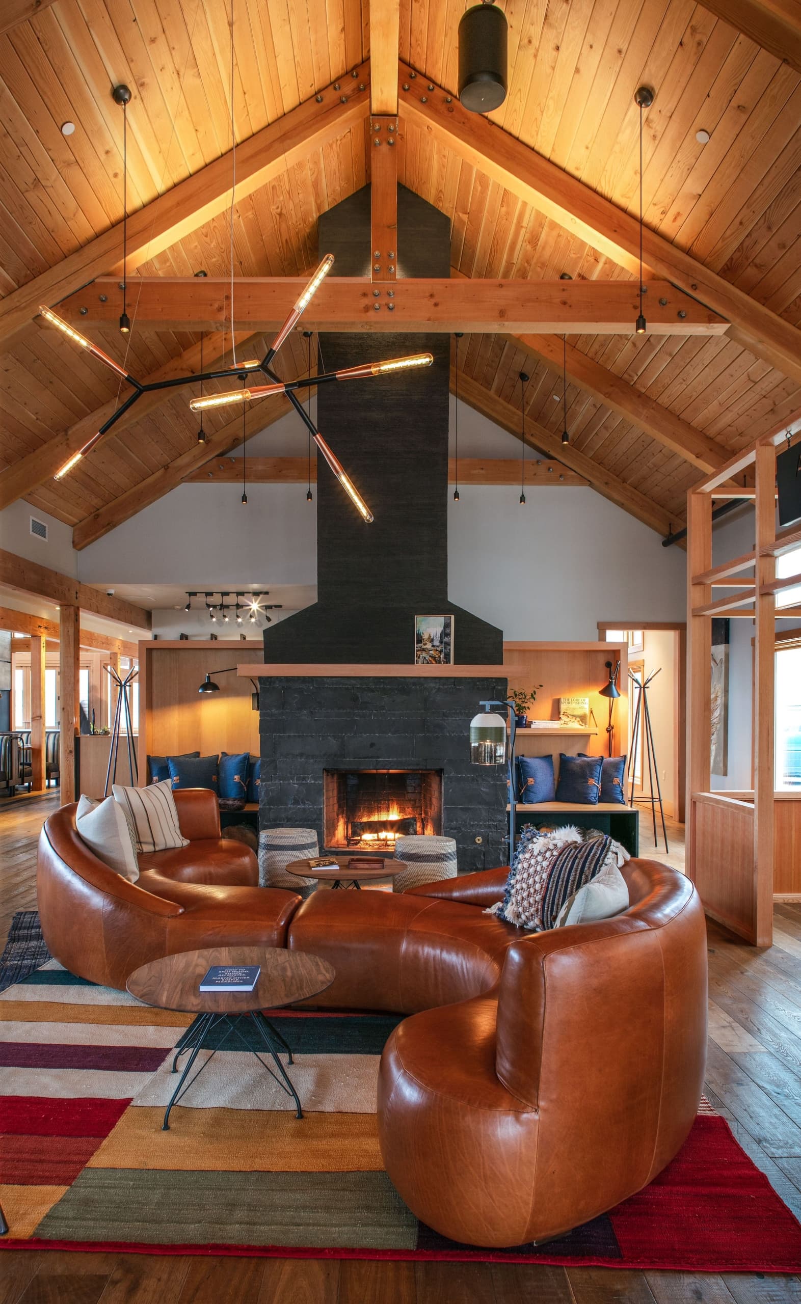 An S-shaped couch for lounging in front of the fireplace at Headlands