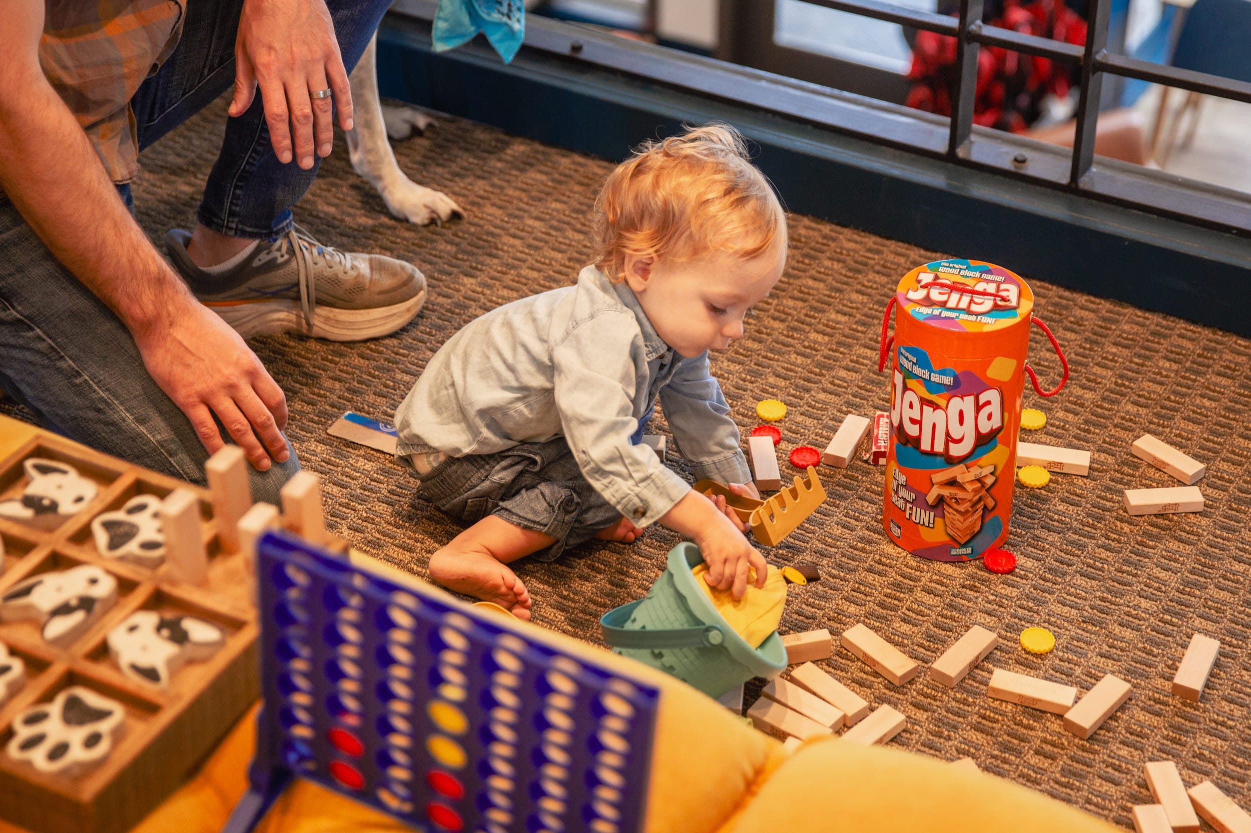 I child playing with some boardgames at Inn at Cape Kiwanda