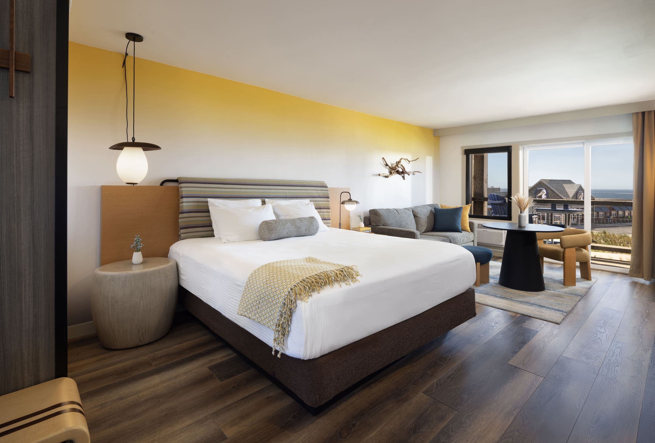 Inn At Cape Kiwanda Signature King room with an open concept living and a balcony