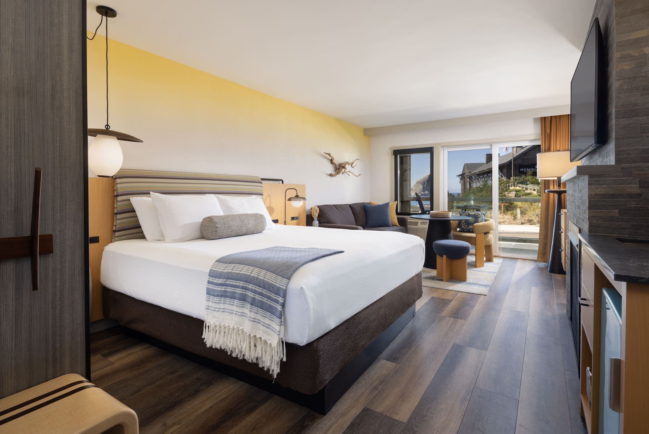 Inn At Cape Kiwanda Signature King Accessible with a balcony, fireplace and living space.