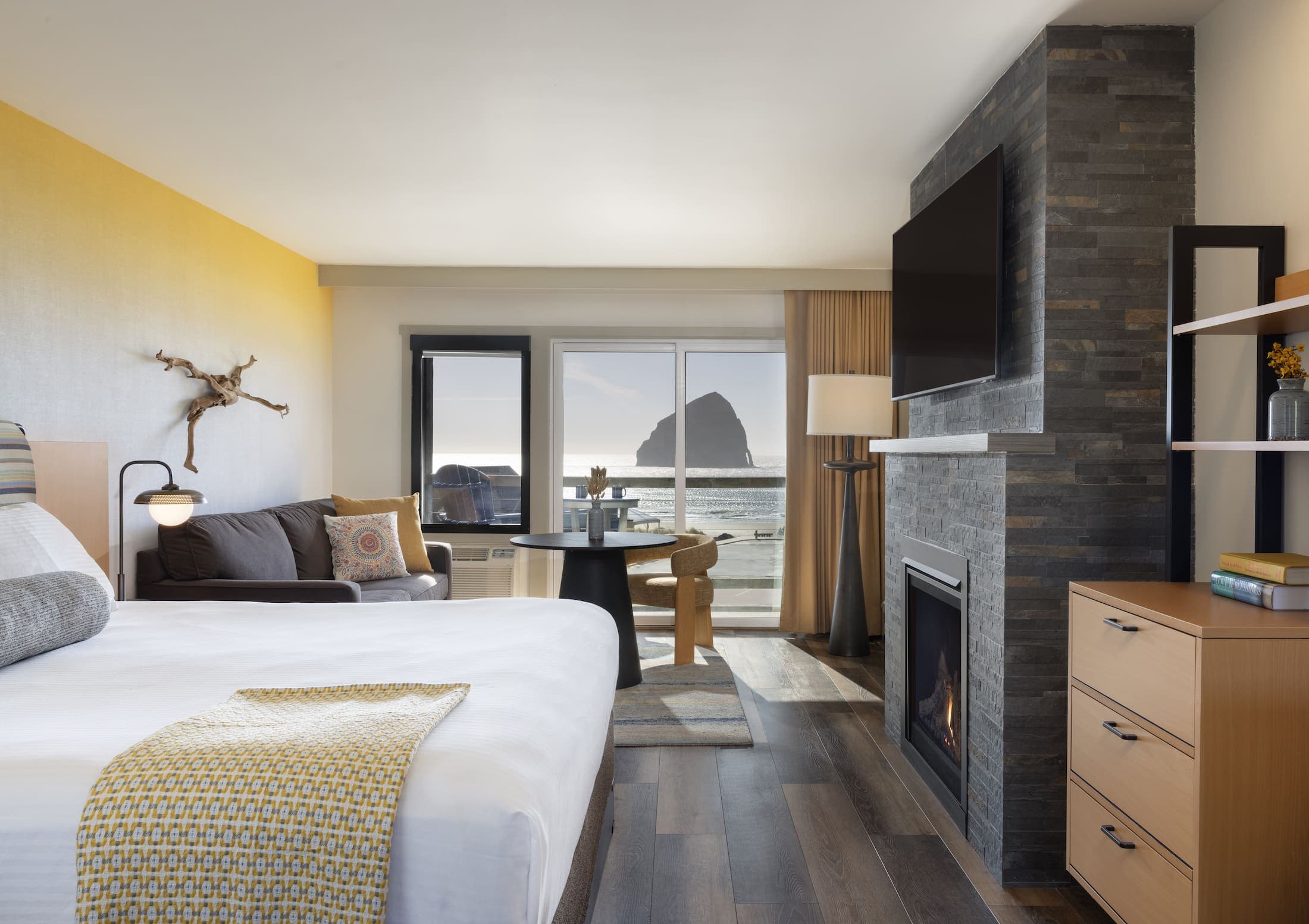 Inn At Cape Kiwanda Top Floor King open concept space with balcony and view of the beach