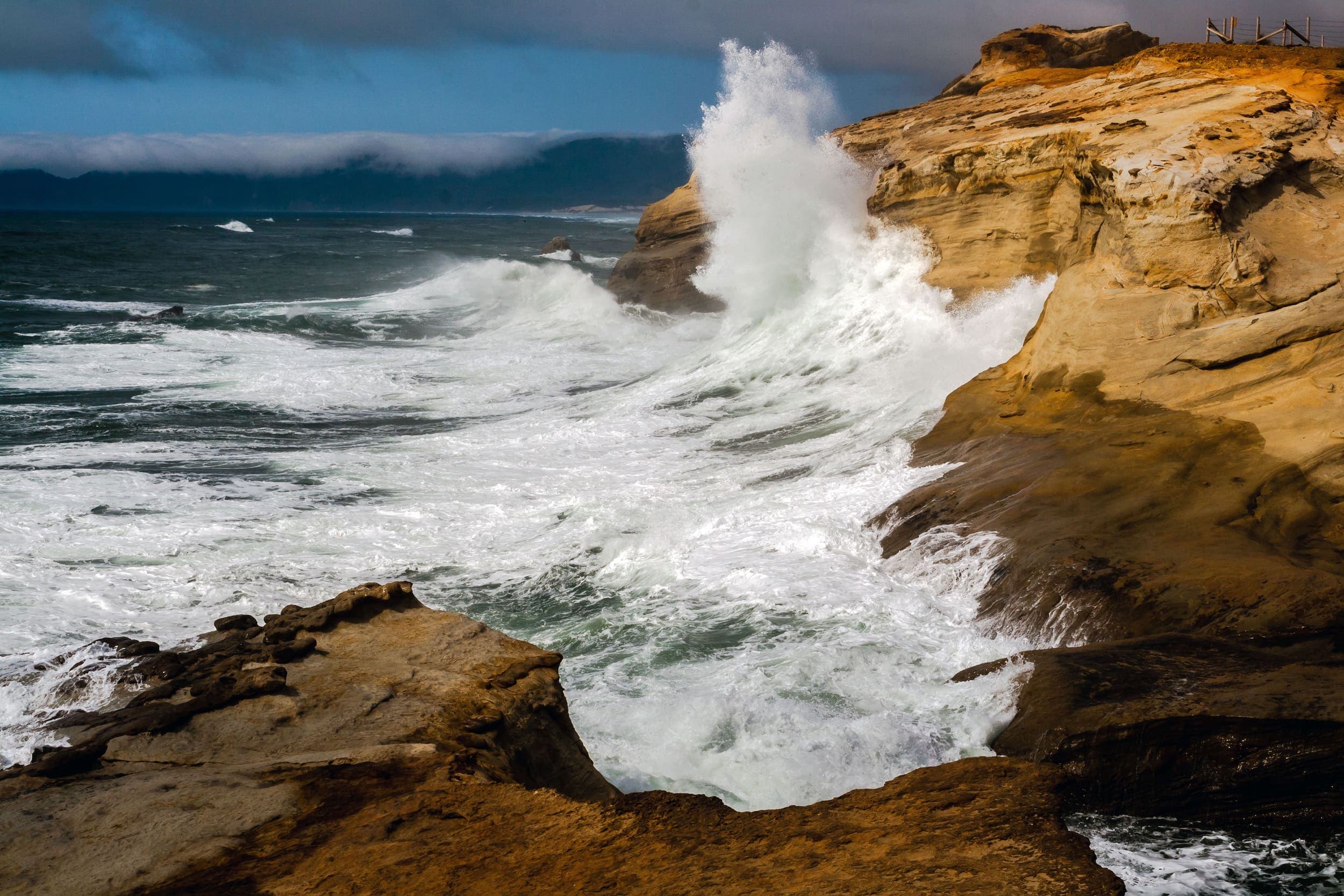 View of large waves hitting the side of the shore at King Tides