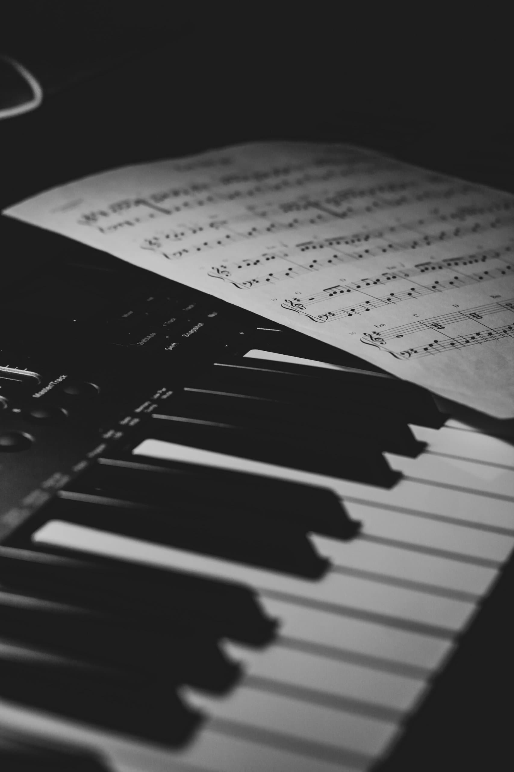 Piano keys and sheets music